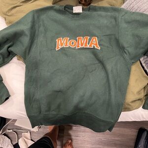 Moma Green Sweater with Orange Logo